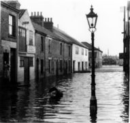 Black and White photo depicting flood waters in St Johns Road, Lowestoft after the 1953 tidal surge. Newsquest Archive